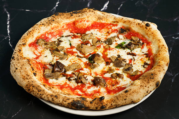 Neapolitan pizza with porcini mushrooms and mozzarella