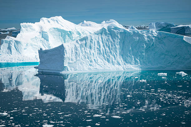 istock Floating Icebergs Reflecting in the Cold Water Under a Blue Sky in Antarctica 2238583324