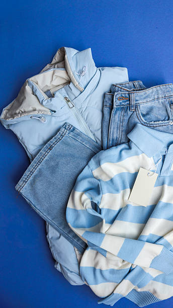 istock Blue clothing items arranged on a vibrant blue background. 2238583474
