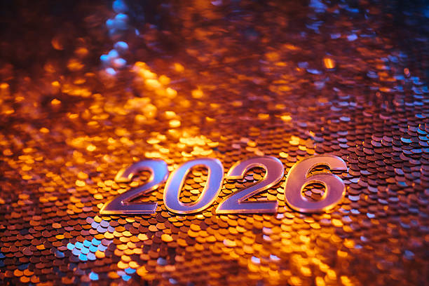 istock Golden 2026 Numbers on Sparkling Sequin Background with Festive Lighting 2238584922