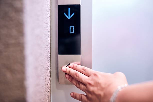 istock Person pressing elevator buttons in the building. 2238587984