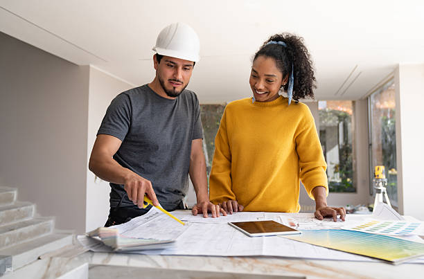 istock Building contractor talking to an interior designer while remodeling a house 2238588142