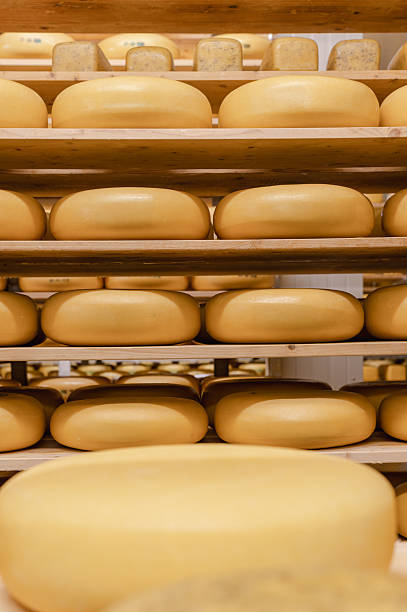 istock Wooden Shelves with Cows Milk Cheese 2238589525