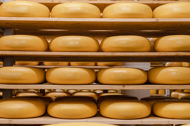 istock Wooden Shelves with Cows Milk Cheese 2238589598