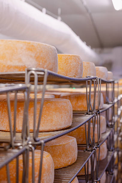 istock Wooden Shelves with Cows Milk Cheese 2238589891