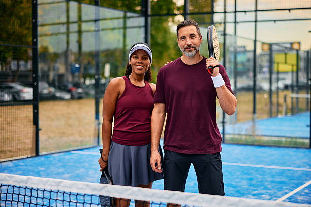 istock Diverse couple posing on padel court smiling 2238590028