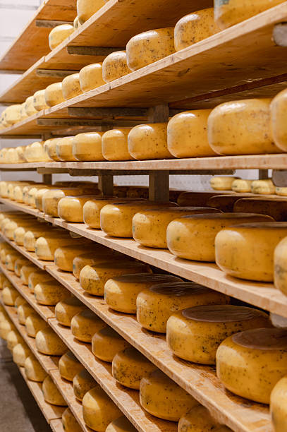 istock Wooden Shelves with Cows Milk Cheese 2238590163