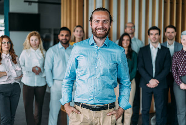 istock Confident businessman and his team. 2238591372