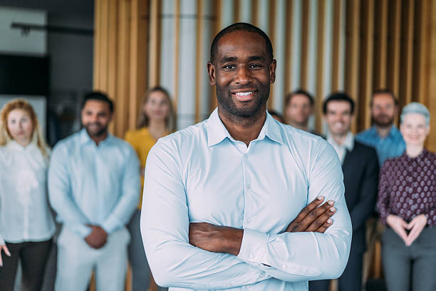 istock Confident businessman and his team. 2238591380