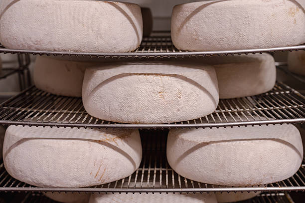 istock Wooden Shelves with Cows Milk Cheese 2238591813
