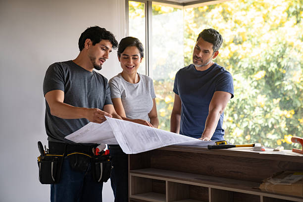 istock Civil engineer looking at a blueprint while remodeling their house 2238592390