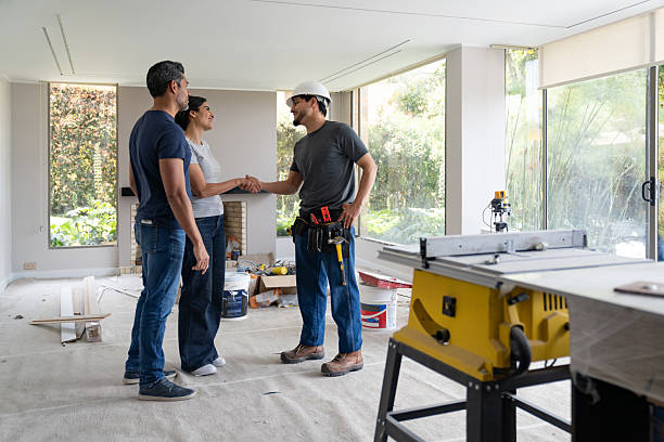 istock Couple greeting a building contractor with a handshake at a house 2238592391