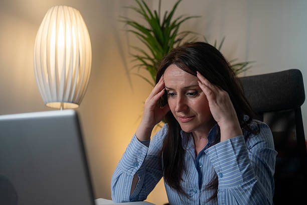 istock Business woman having headache at office 2238595999