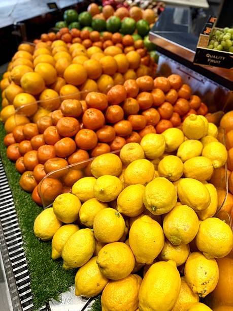 Fresh lemons and oranges on market display