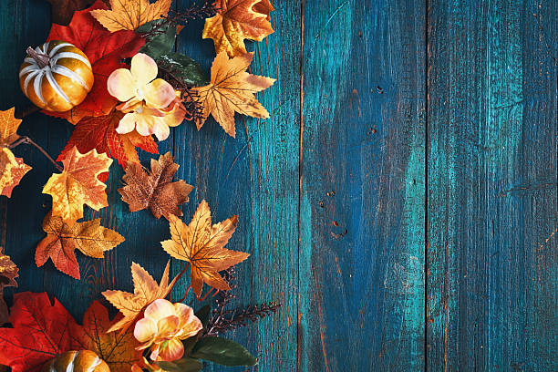 istock Autumn Decoration with Leafs and Pumpkins on Rustic Background 2238599527