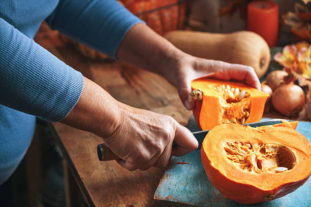 istock Cutting Pumpkin on Wooden Board 2238599831