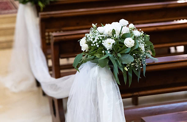 istock Wedding-ready church with white tulle and flowers 2238600985