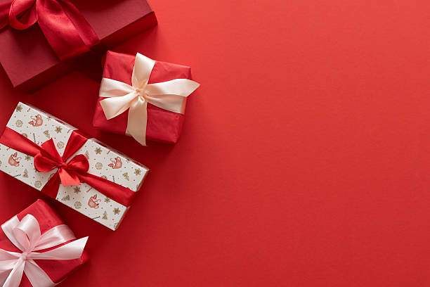istock Border from Christmas gifts on a red background. 2238601785