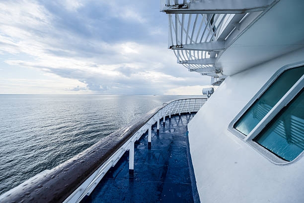 istock Passenger ferry bow deck with ocean horizon under cloudy sky.. 2238606805