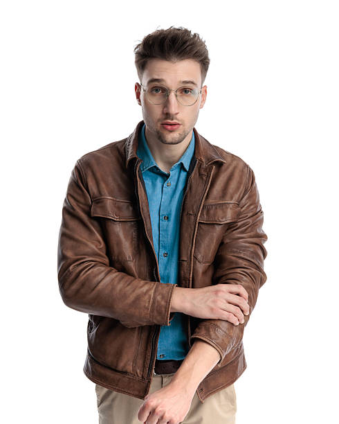 istock confident casual man with glasses adjusting brown leather jacket 2238611808