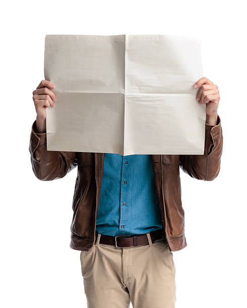 istock casual man in brown leather jacket hiding behind newspaper 2238612306