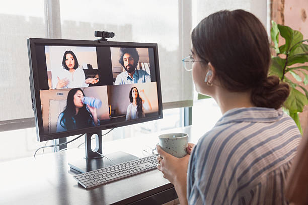istock Diverse team collaborates virtually during video conference, brainstorming ideas for business project success. 2238616346