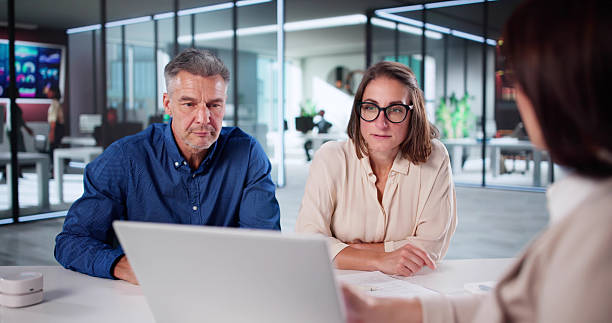 istock Discussing Future Finances: Couple Meets Wealth Advisor 2238617554