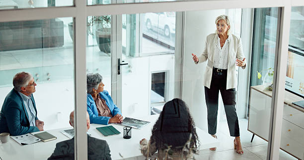 istock Presentation, workshop and mentor with business people in office for discussion, planning and project management. Corporate, teamwork and speaker with seminar for brainstorming, strategy and meeting 2238619638