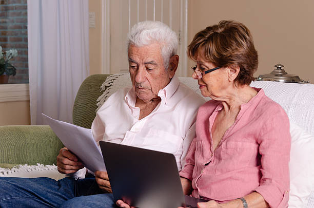 istock A senior couple with a laptop at home. 2238620033