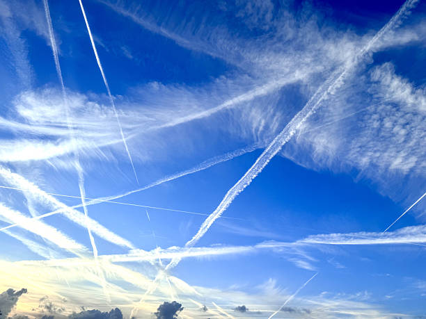 istock Blue sky with airplane contrails 2238621500
