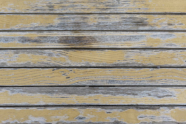 Gray and yellow old wooden background, designer backdrop. Copy space