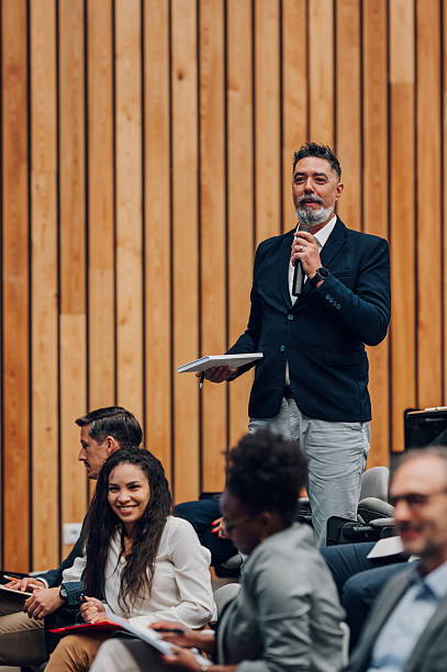 istock Speaker presenting to diverse business audience at conference 2238623656