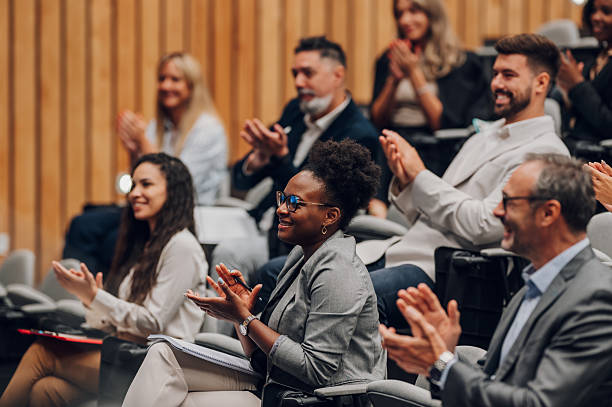 istock Diverse business audience applauding during corporate seminar 2238623660