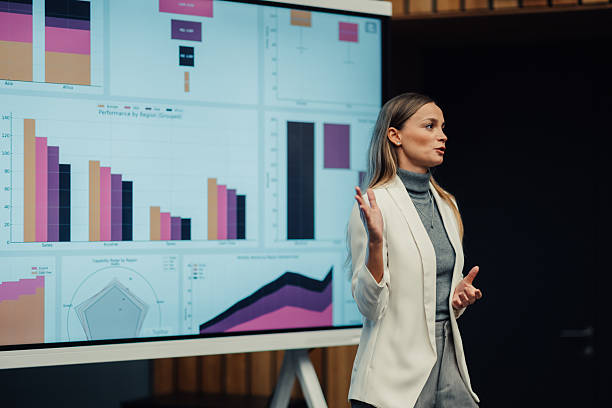 istock Businesswoman giving a presentation about data analysis and charts 2238625642
