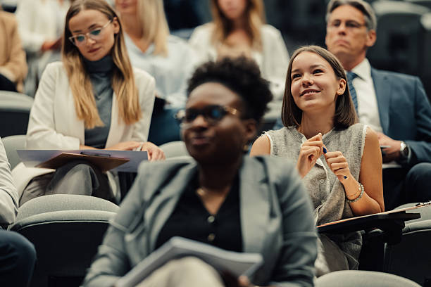 istock Diverse audience attentively listening during engaging business conference 2238625653
