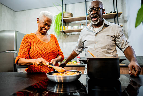 istock Senior couple cooking at home 2238630481