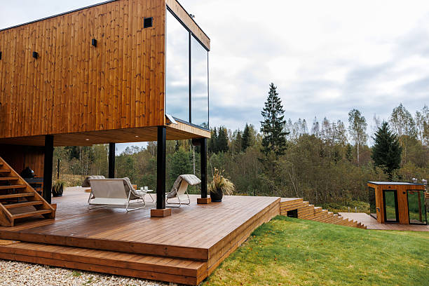 istock Modern Wooden House with Deck and Detached Structure in Natural Setting 2238630817