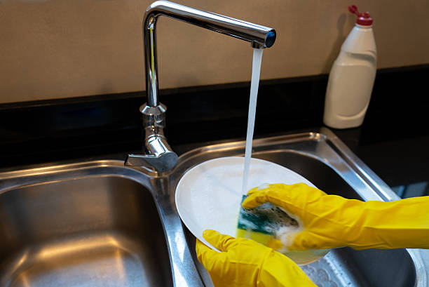istock Hand Washing Plates. Soapy Sponge at Sink 2238638328