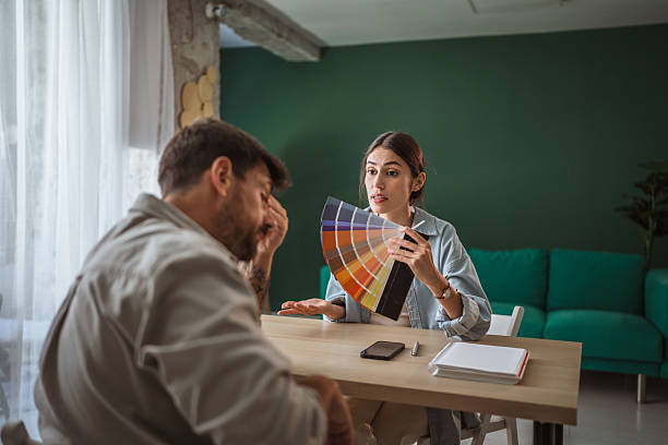 istock Interior designer presenting color palette to male client 2238639426