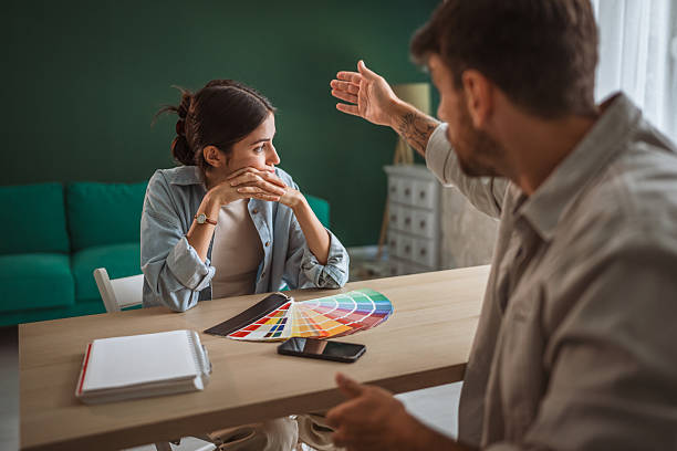 istock Couple arguing about home decor choices and design 2238639630