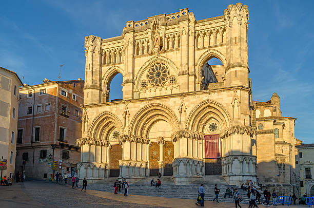 Cuenca, Spain - March 28, 2015: People in the Plaza Mayor (main square) of Cuenca, Castilla La Mancha, Spain, with the Gothic Cathedral of Saint Mary and Saint Julian in the background