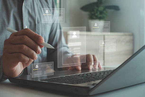 istock HR manager using digital interface to review candidate profiles with ratings and resume details, representing online recruitment, digital hiring process and human resource evaluation system. 2238641191