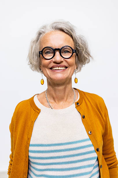 istock Happy senior woman looking at camera in studio 2238643411