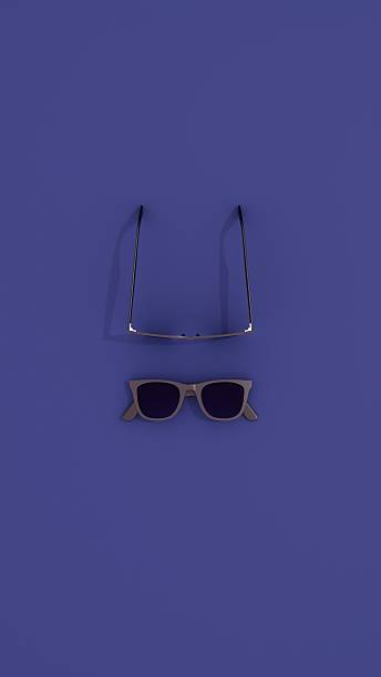 istock Minimalist layout of sunglasses pair on blue surface 2238643450