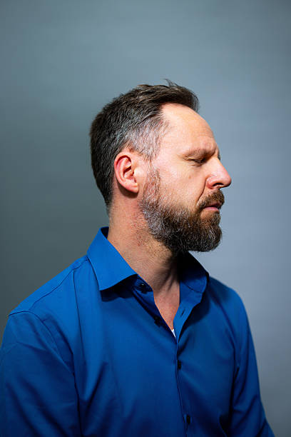 istock Profile portrait of pensive mature man with beard in studio 2238644014