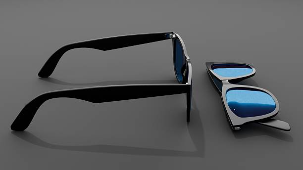istock Two pairs of sunglasses arranged on gray surface 2238644246