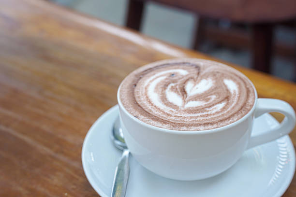 istock A cup of coffee with latte art on a wooden table 2238646214