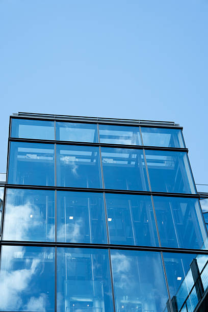 istock Modern Glass Office Building Against Blue Sky 2238647189