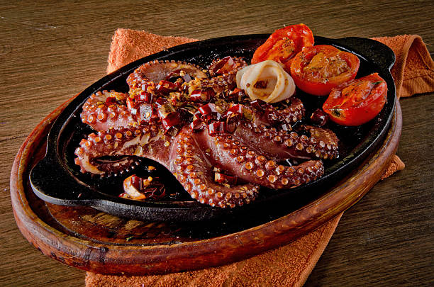 istock Grilled Octopus with Garlic and Chili (Pulpo al Ajillo) on a Sizzler Plate 2238647726