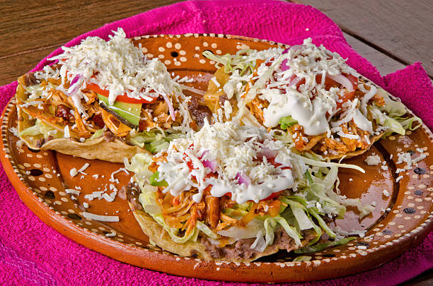 istock Authentic Mexican Chicken Tinga Tostadas with Cream and Fresh Cheese 2238649208